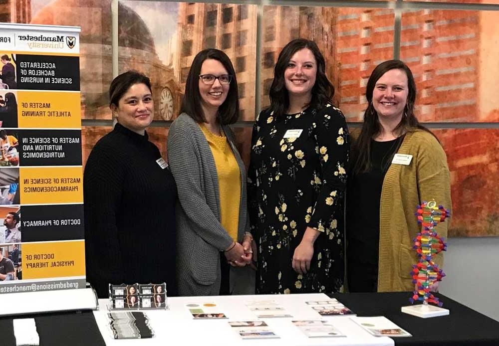 Office of Graduate Admissions staff together at a recruitment event